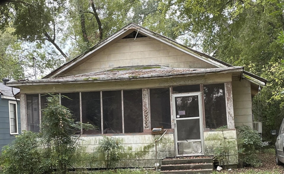 View of front of home with a enclosed porch