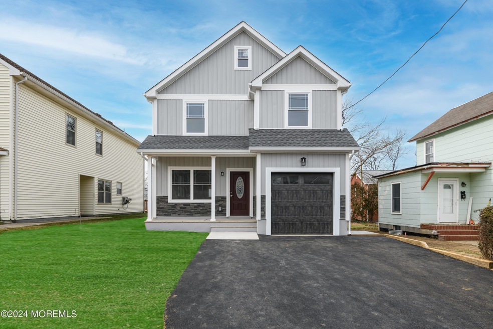 Front of Home with grass digitally enhan