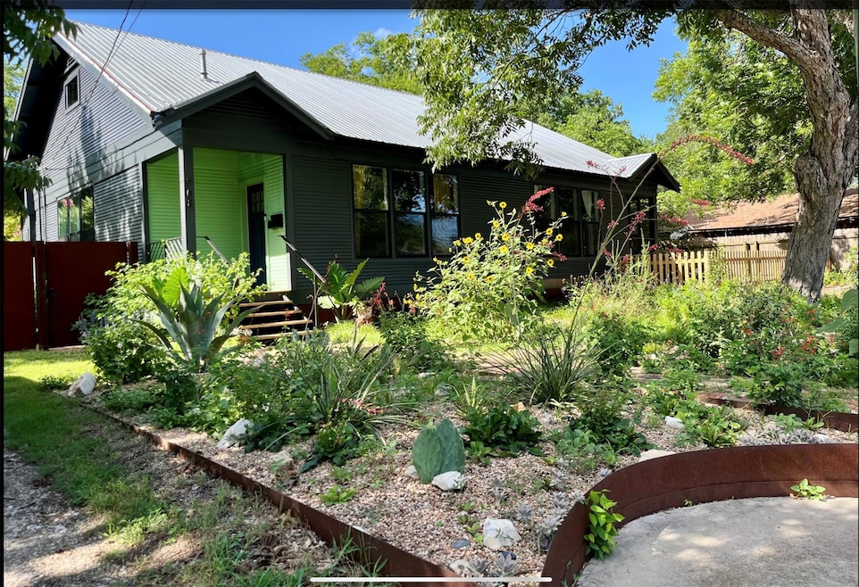 View of front of property with a metal roof