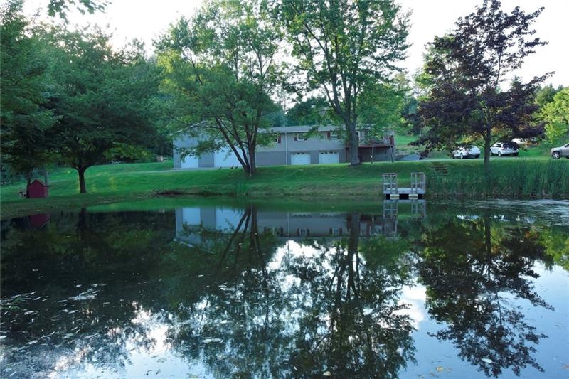 Front street view, overlooking 3/4 acre pond