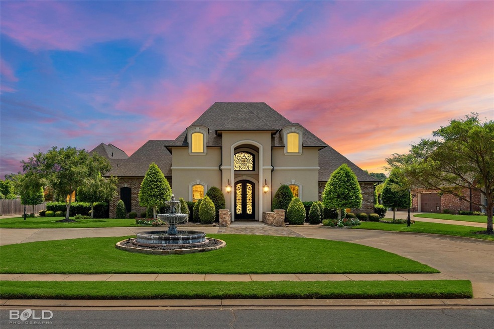 French country home featuring a large three tier w