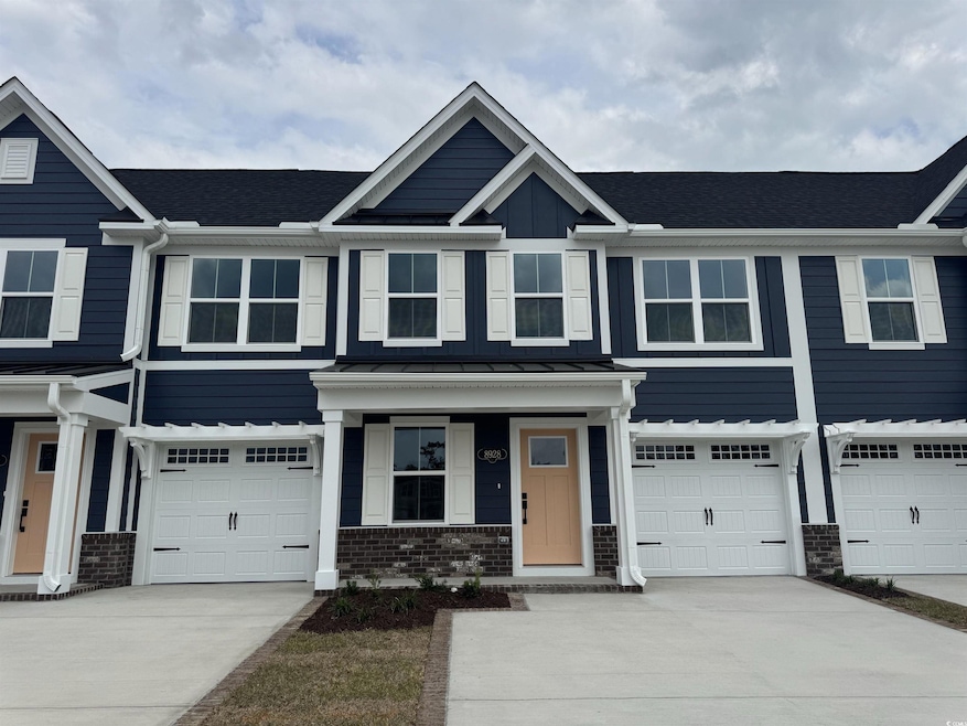 View of front of house with a standing seam roof, 