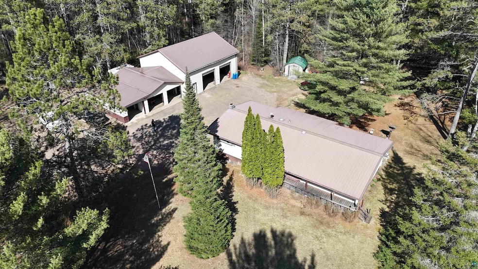 Drone / aerial view featuring a forest view