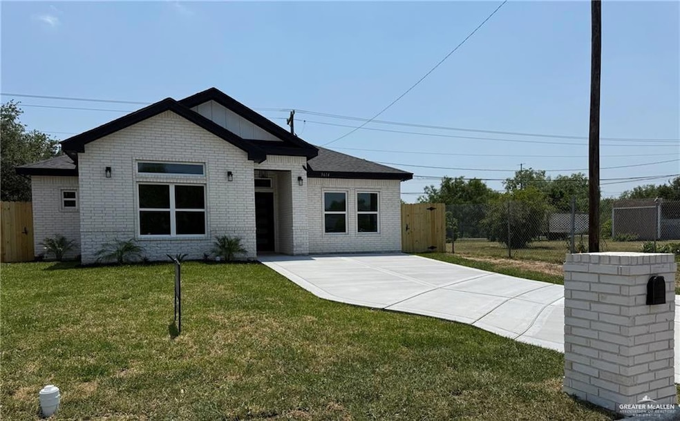 View of front facade with brick siding and concrete driveway