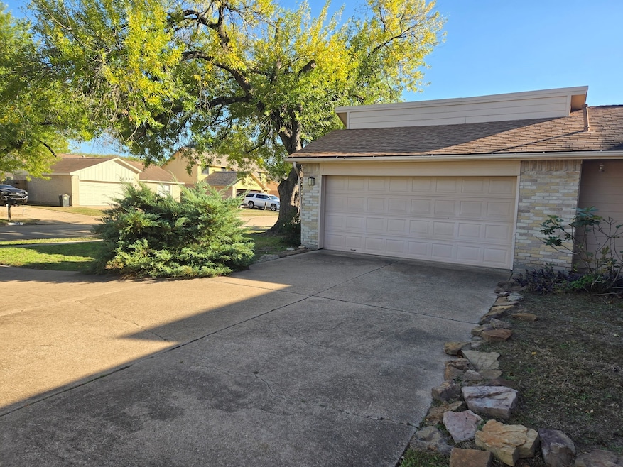 Side view of front yard and garage