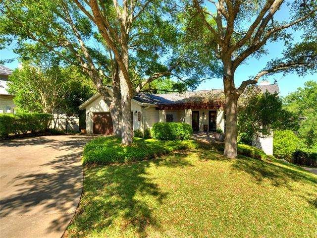 Graced by lovely oaks and nice landscaping, this h