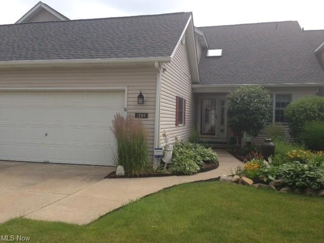 Covered front porch entry, 2 car attached Garage