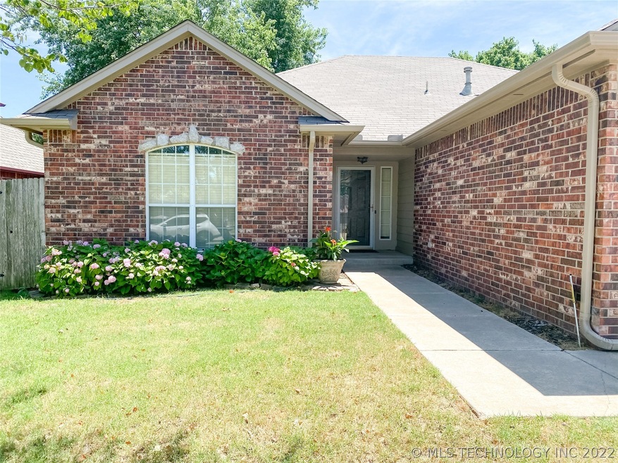 Charming entrance with fresh paint and gutters all