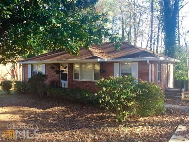 This yard features a beautiful magnolia tree to we