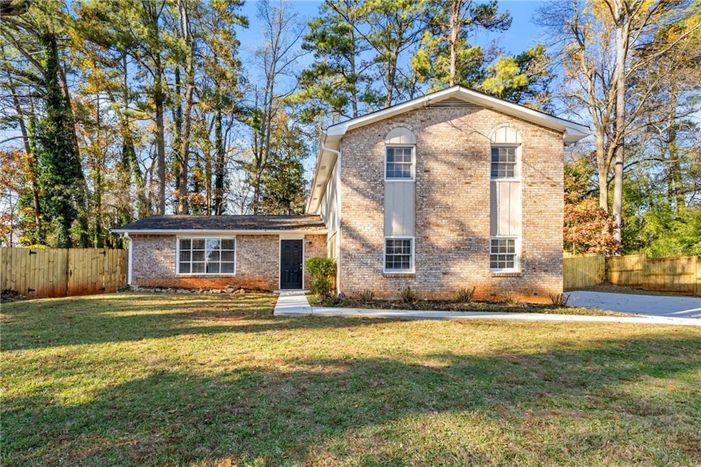 View of front of house featuring brick siding