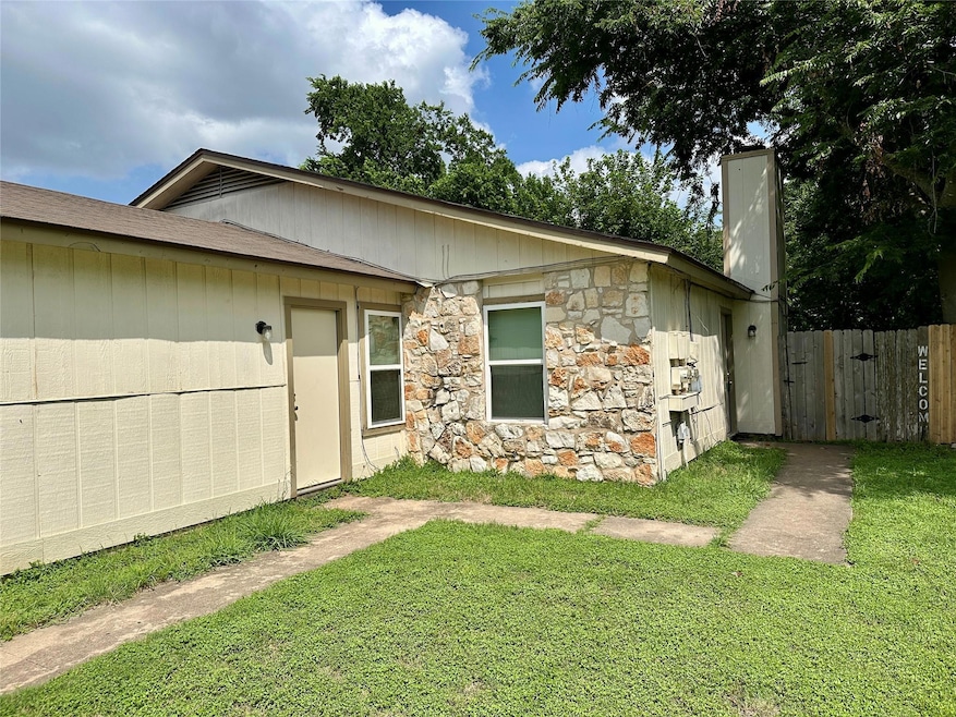View of front of house featuring stone siding and