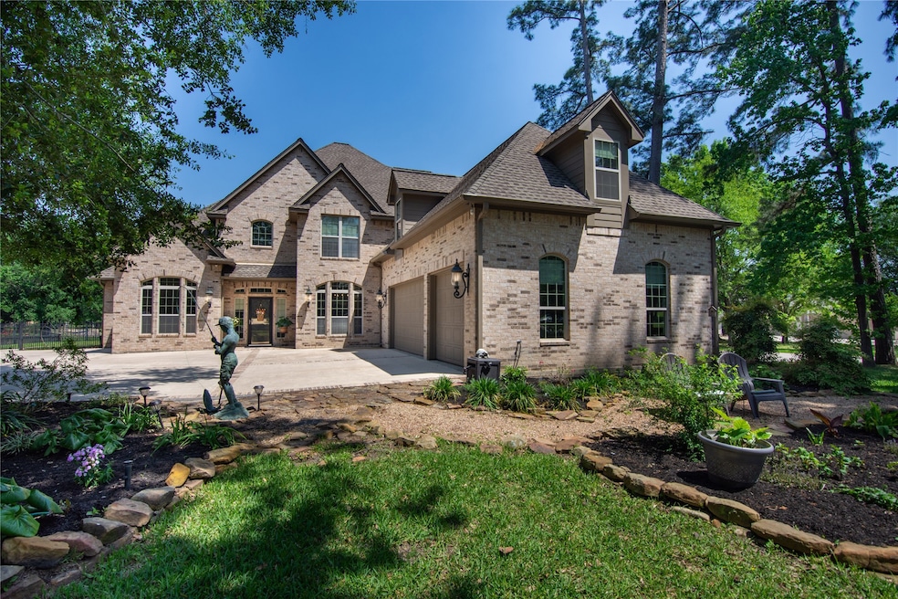 Spacious brick house with a three-car garage and a