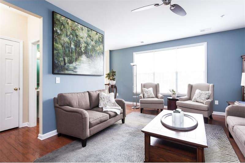 Large living room with an abundance of natural lig