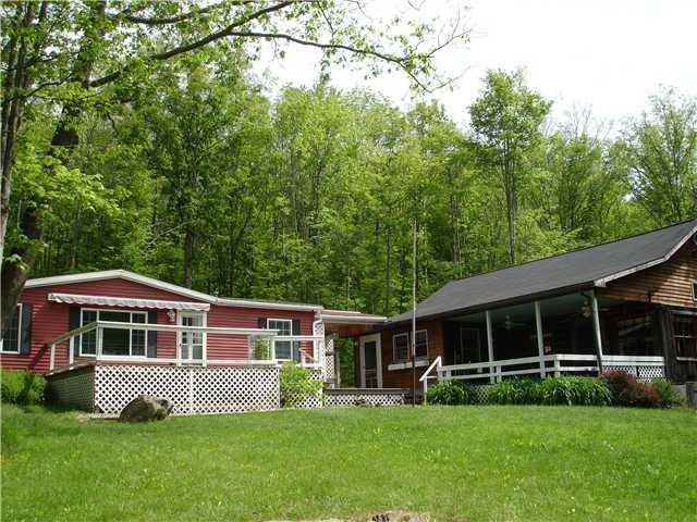 Exterior Front. Double wide mobile with three bedr