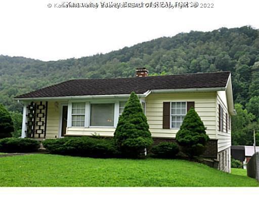 Exterior Front. VINYL SIDED HOME WITH NICE BIG FEN