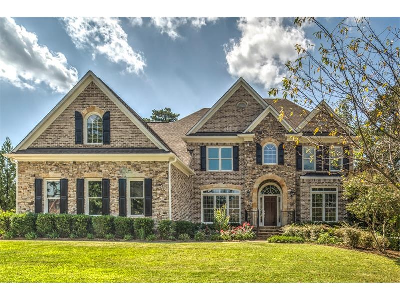 STONE & BRICK. Huge flat front yard. 3-car garage.