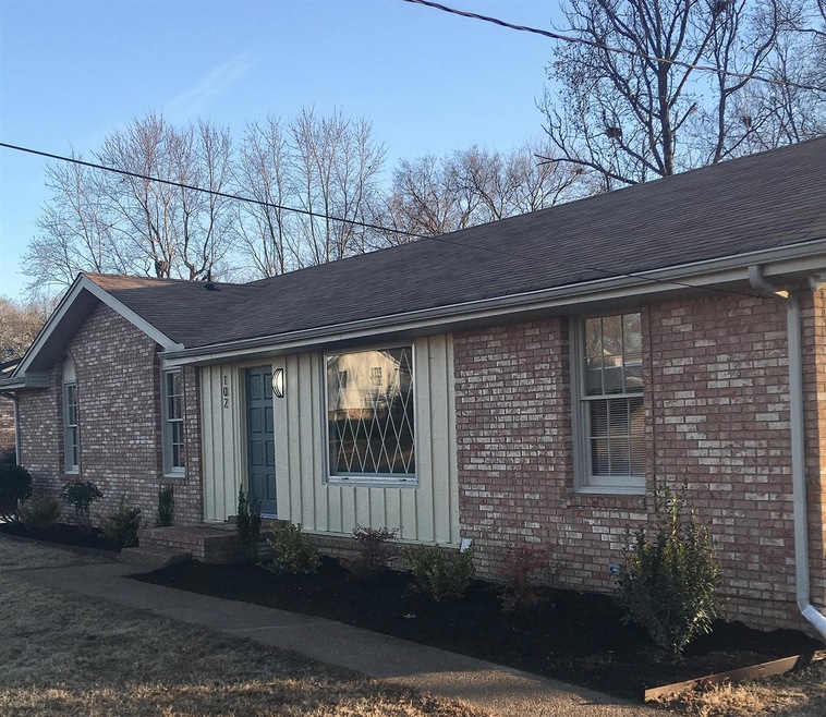 All brick ranch on landscaped lot with paved walkway and driveway, freshly updated with accent paint, new mailbox, new landscaping. 