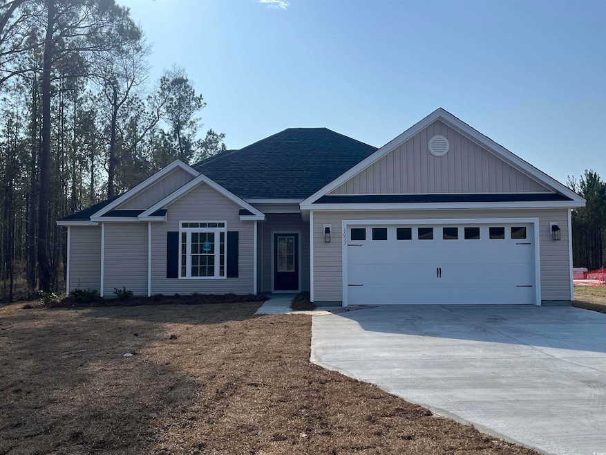 View of front of home featuring a garage