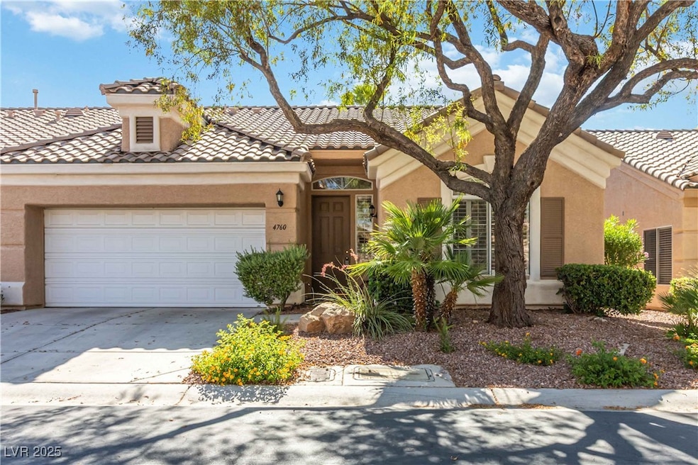 Mediterranean / spanish-style house featuring a ti