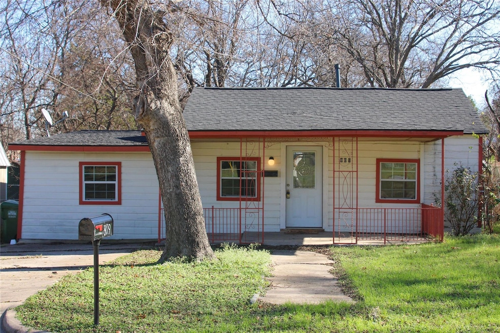 View of front of house featuring a porch, roof wit