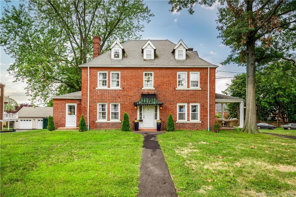 Gracious and elegant.  This 5 bedroom brick coloni