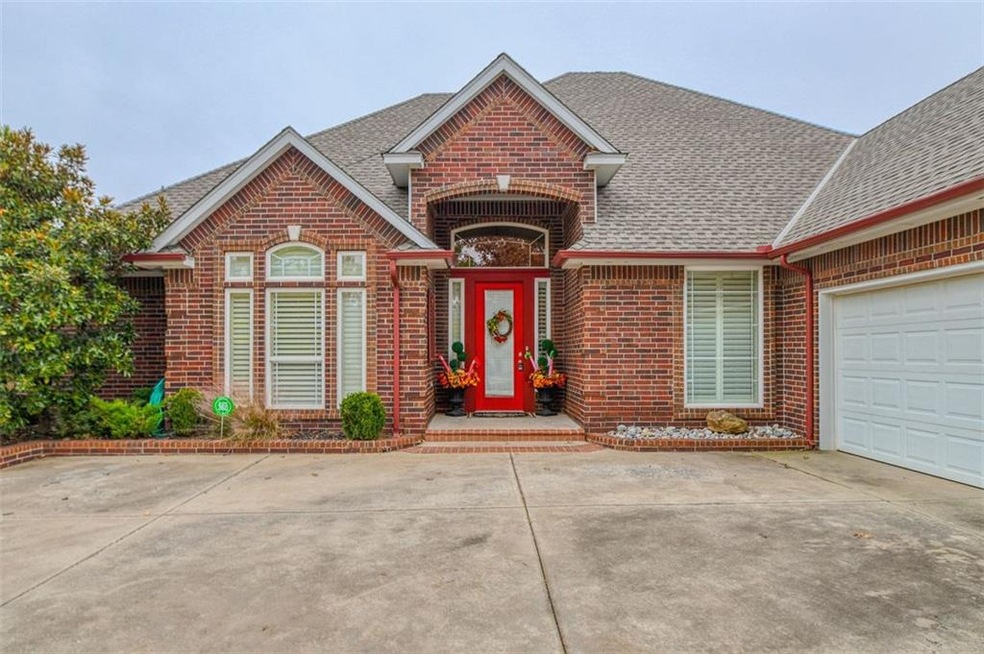 Beautiful red door makes the entrance pop!   3 car