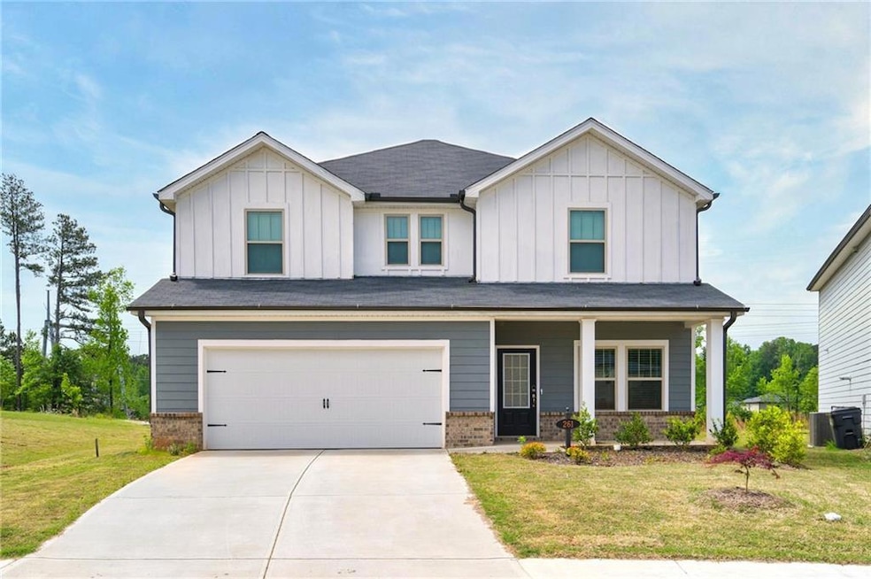 View of front of property with a garage and a fron