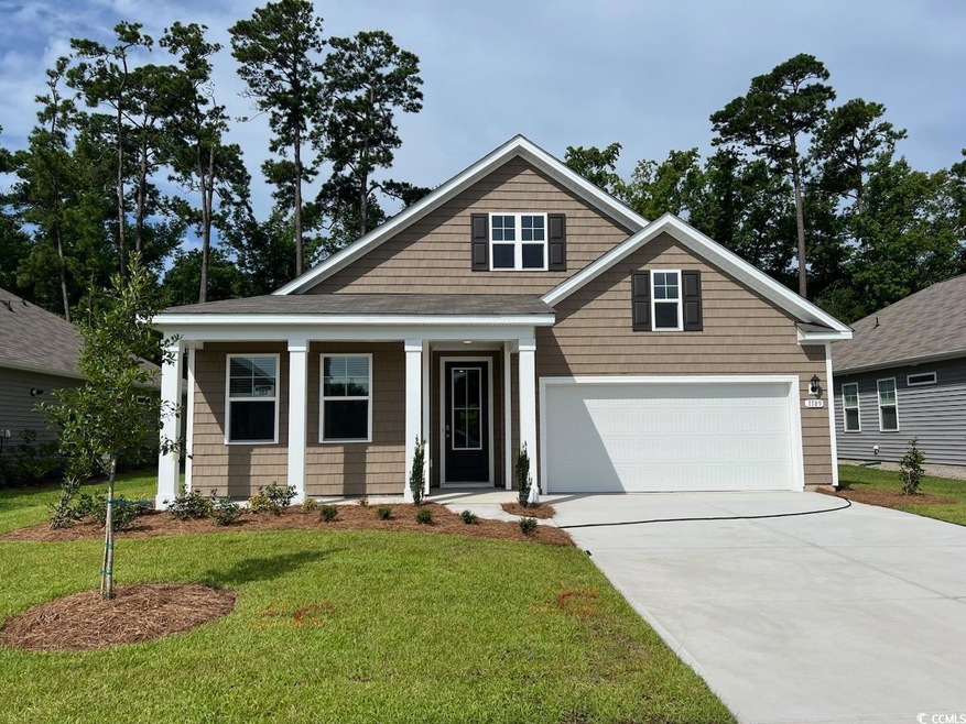Craftsman-style house featuring a garage and a fro