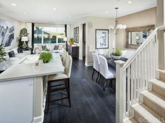 Living room and dining room (model home shown, act