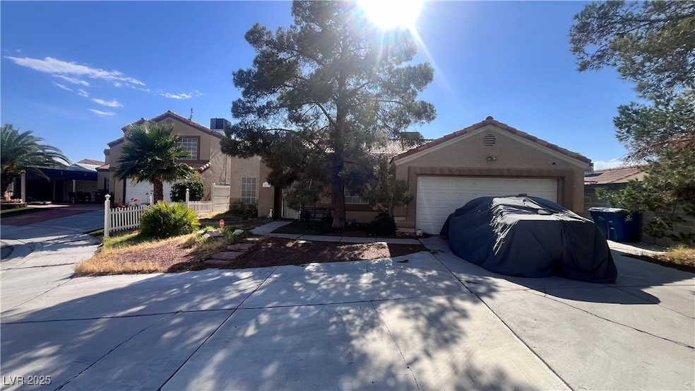 View of front facade with concrete driveway, stucc