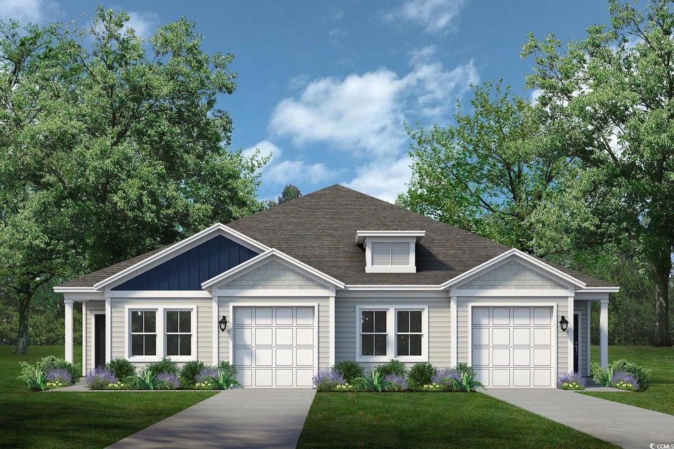 View of front of home with a front yard and concrete driveway