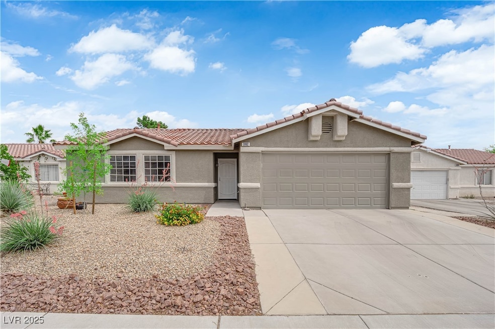 Single story home featuring a garage, stucco sidin