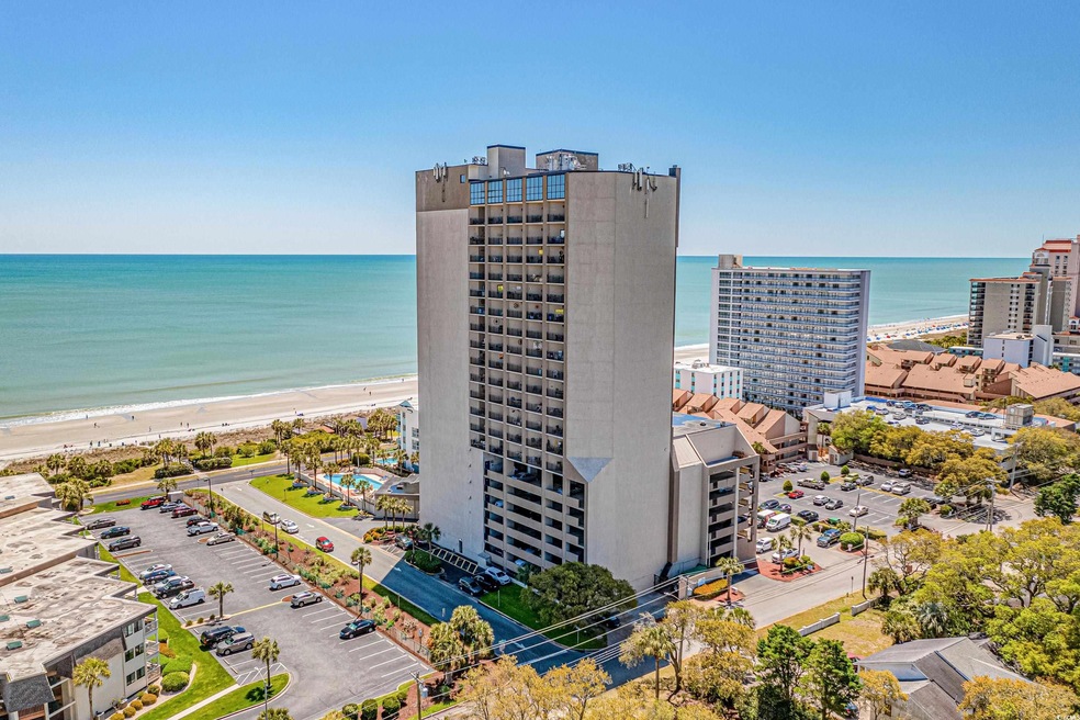 Aerial view featuring a view of the beach and a wa