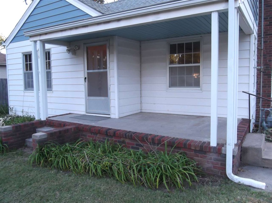 Charming covered porch perfect for a favorite swin