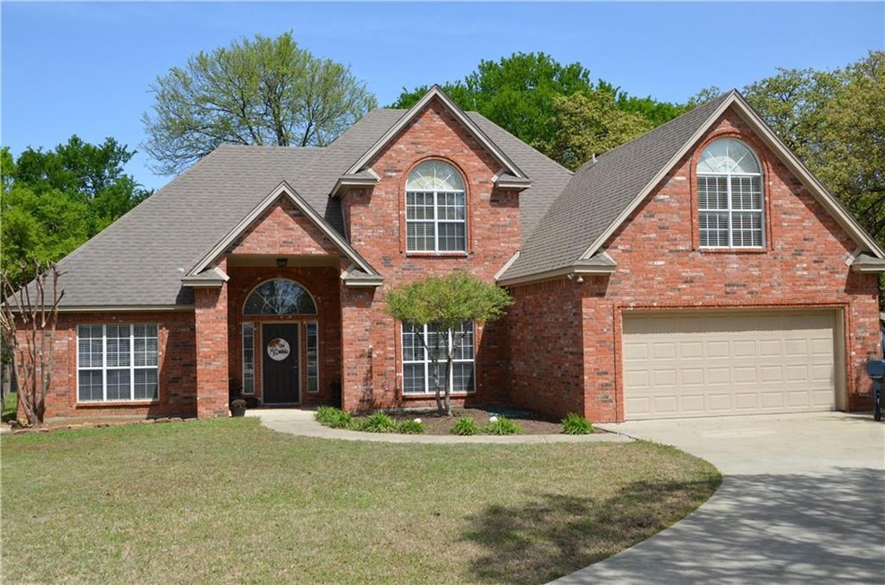 Pretty setting for this two story brick home with 