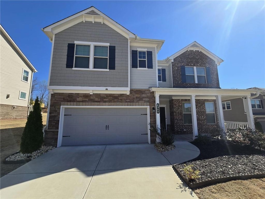 View of front of property featuring an attached ga