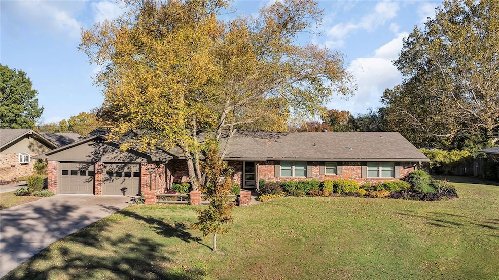 View of front facade with a front yard and a garag