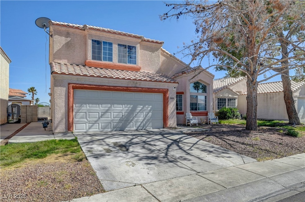 Mediterranean / spanish-style home featuring a til