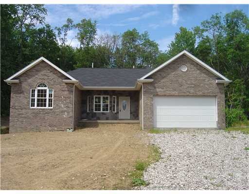 Exterior Front. New construction with a stone and