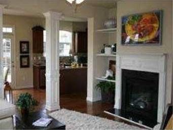 Exterior Front. Spacious Family Room with Cozy Fir