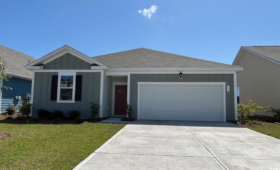 Ranch-style home featuring board and batten siding