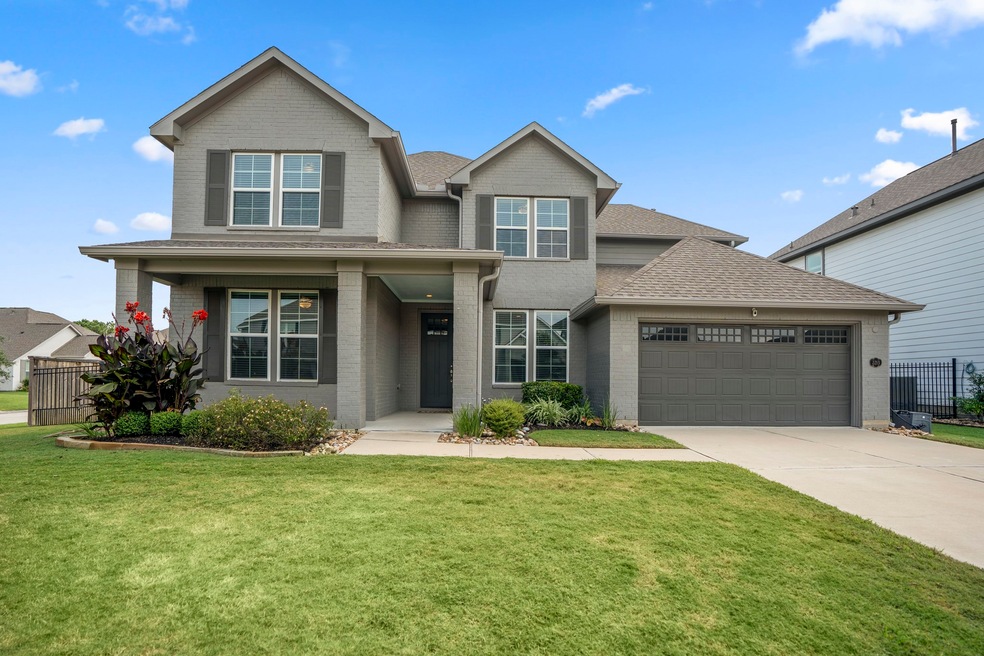 Welcome home to this exemplary residence in the highly desirable Stillwater community! Situated on a spacious corner lot, the well-manicured yard and covered front porch enhance the home's alluring curb appeal.