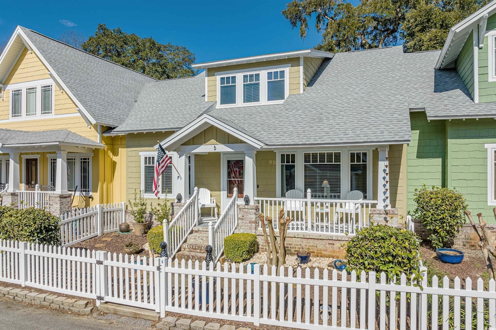View of front of house with covered porch and a sh