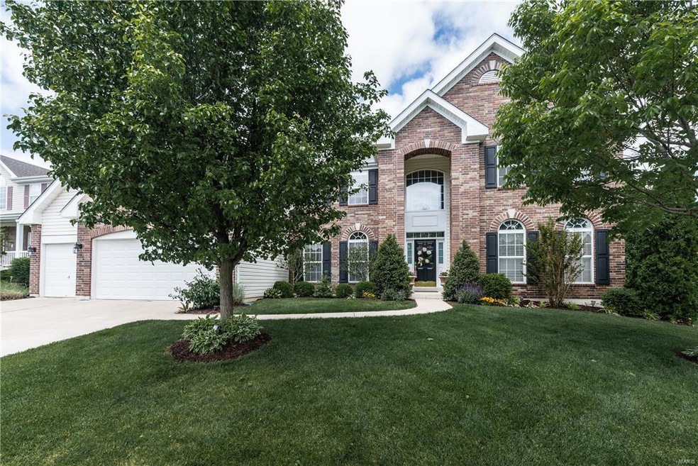 A stunning McBride & Son's 1.5 story home with bri