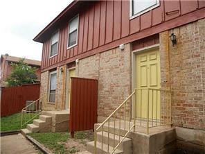View of side of property featuring brick siding, 