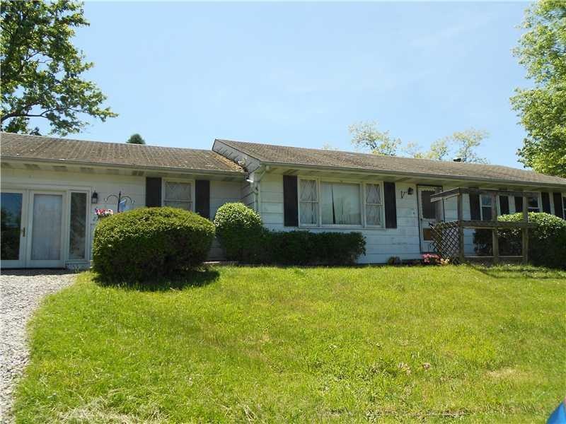 Exterior Front. Sprawling 3 bedroom ranch on 1 .14