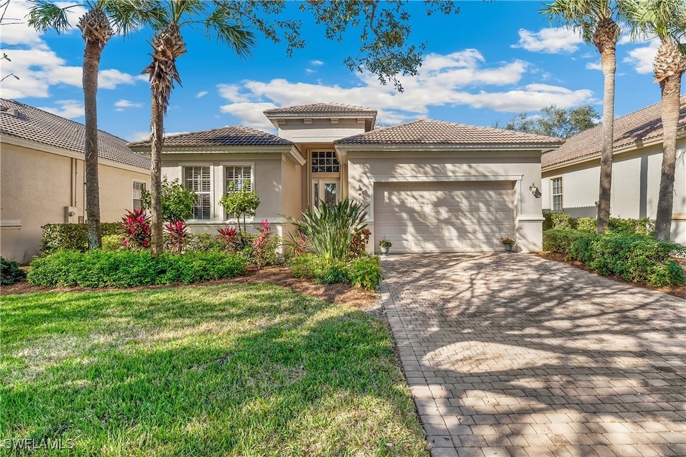 Brick Paver Driveway, Elevated Entry, Tile Roof.