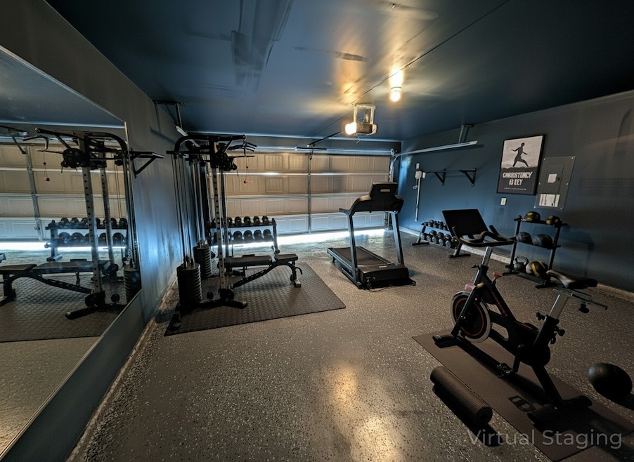 Workout area featuring a garage