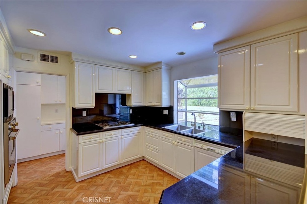 Chef's kitchen, vinyl clad cabinets highlighted by Granite counters
