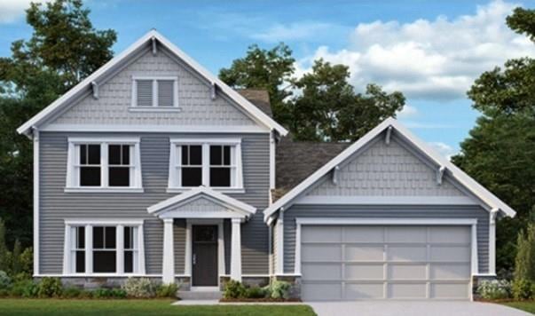 Craftsman inspired home featuring driveway, a gara